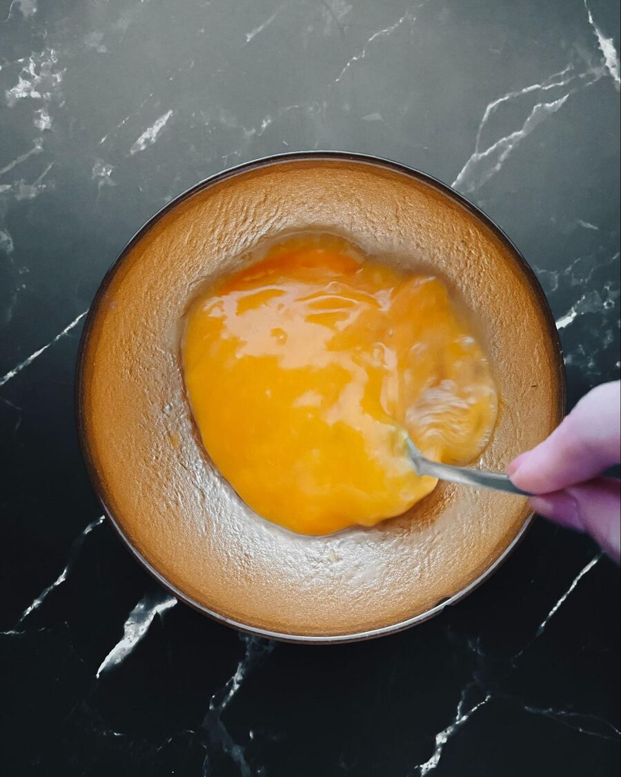 Beat the eggs with a fork until they become frothy.