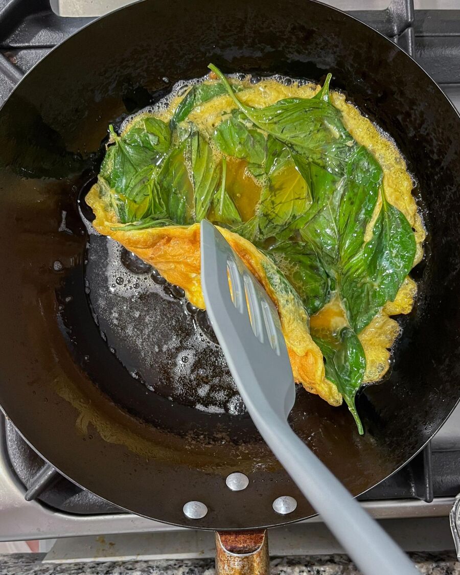 Once the egg has set, check the bottom edges. If they’ve turned golden brown, flip the egg over.