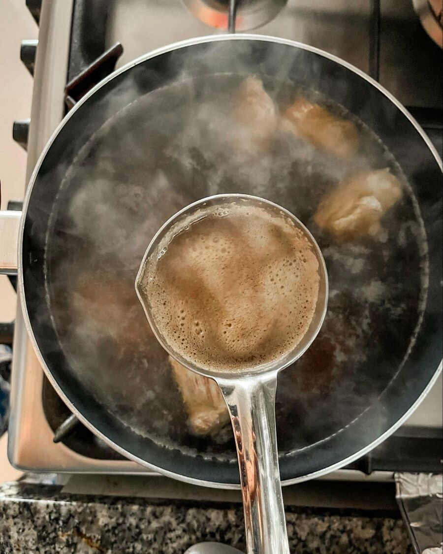 Place a soup pot over medium-high heat. Add the pork spare ribs, chopped radish, dark soy sauce, soy sauce, salt, and pork broth cube. Pour in the water, cover the pot with a lid, and let it simmer for about 30-45 minutes. Once the soup begins to boil and bubbles form, skim off any foam from the surface.