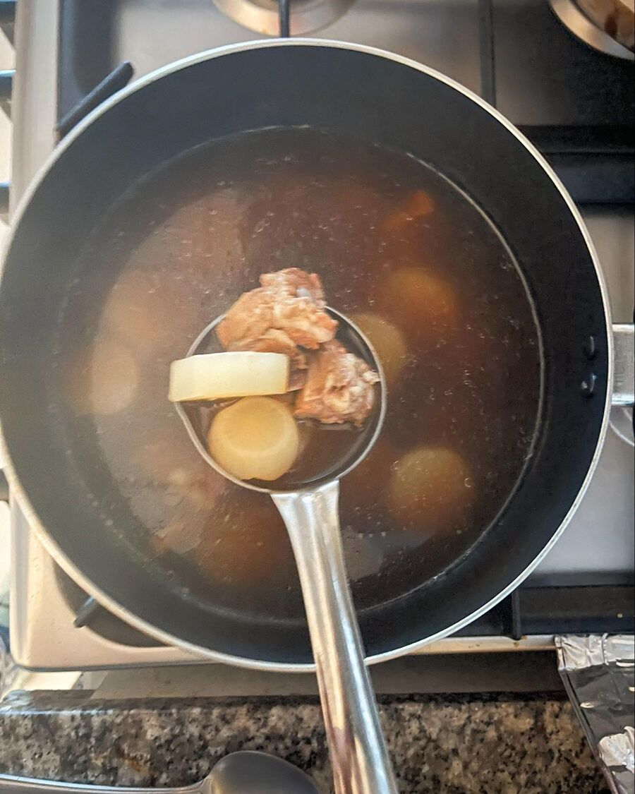 After 30 minutes, check the spare ribs and radish. If they’re tender, reduce the heat to low. Add the meatballs to the soup, cover the pot, and keep it warm until ready to serve.