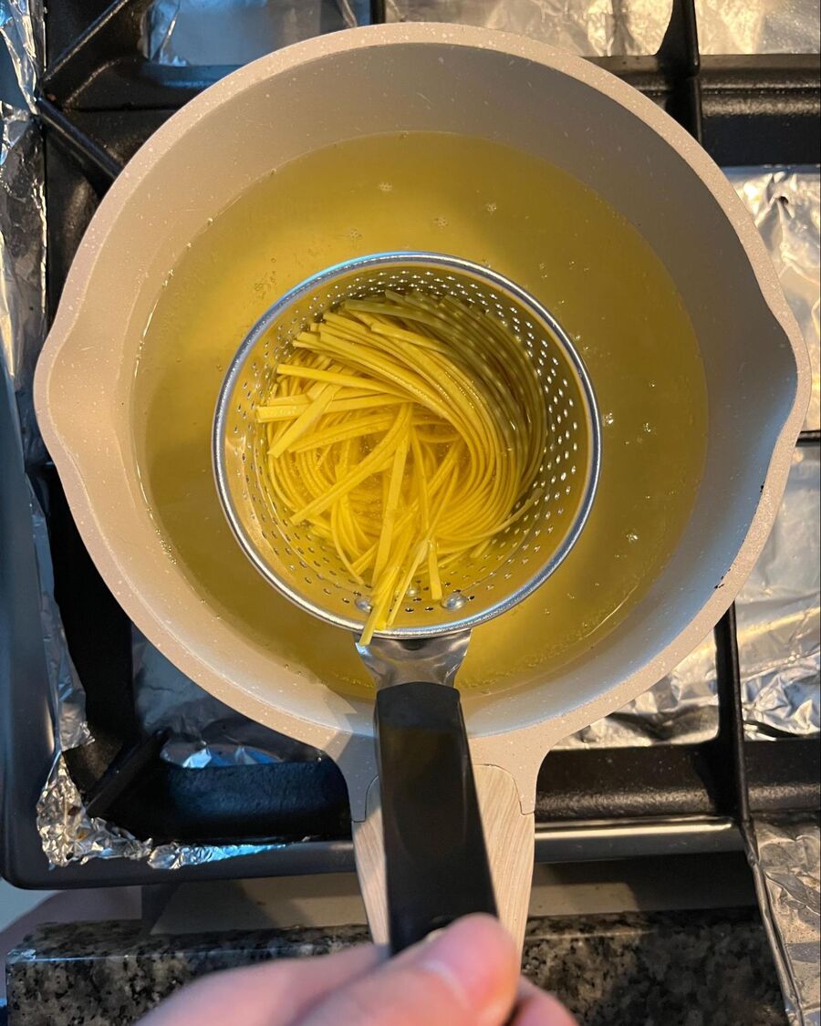 Place another pot over medium-high heat and fill it halfway with water. Once the water comes to a boil, add the noodles and blanch them until tender.