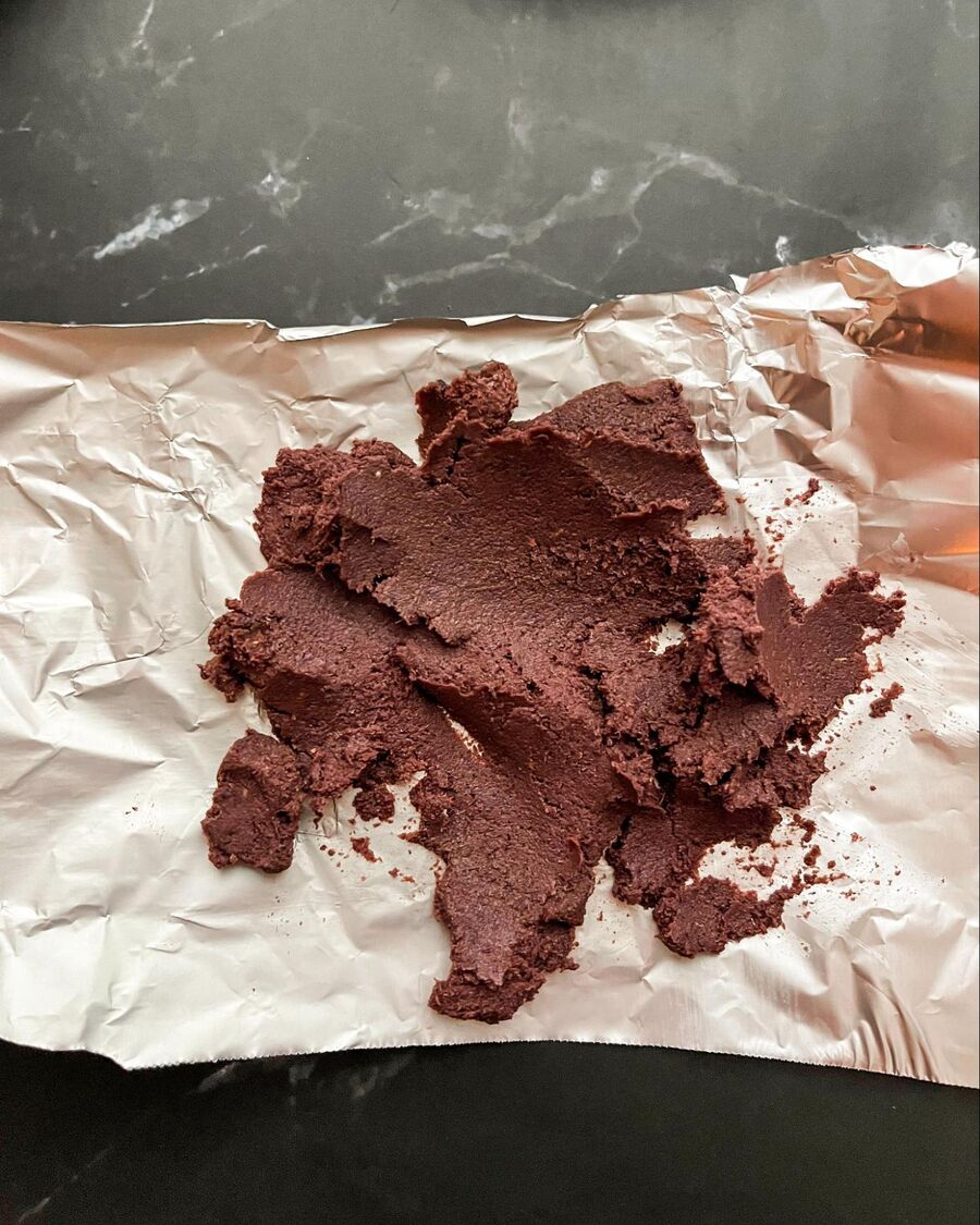 Roasting the shrimp paste helps bring out its aroma. Simply wrap it in foil and cover it to contain the smell while it cooks.