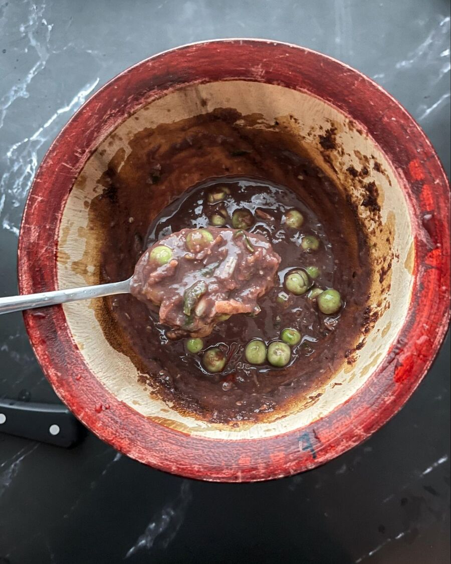 Now adjust the seasoning to your liking. Once you’re happy with the taste, add a few extra chilies and pea eggplants as a garnish.