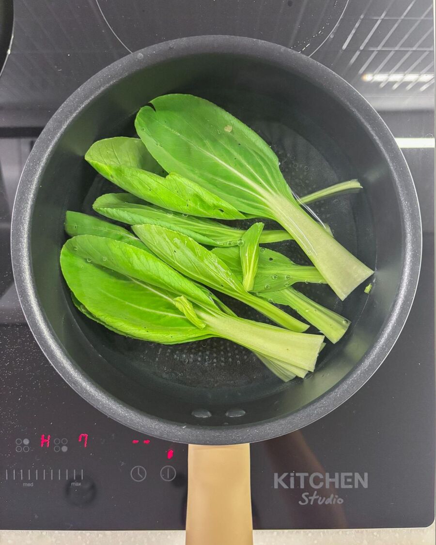 Bring water to a boil in a small pot, then briefly blanch the bok choy.
