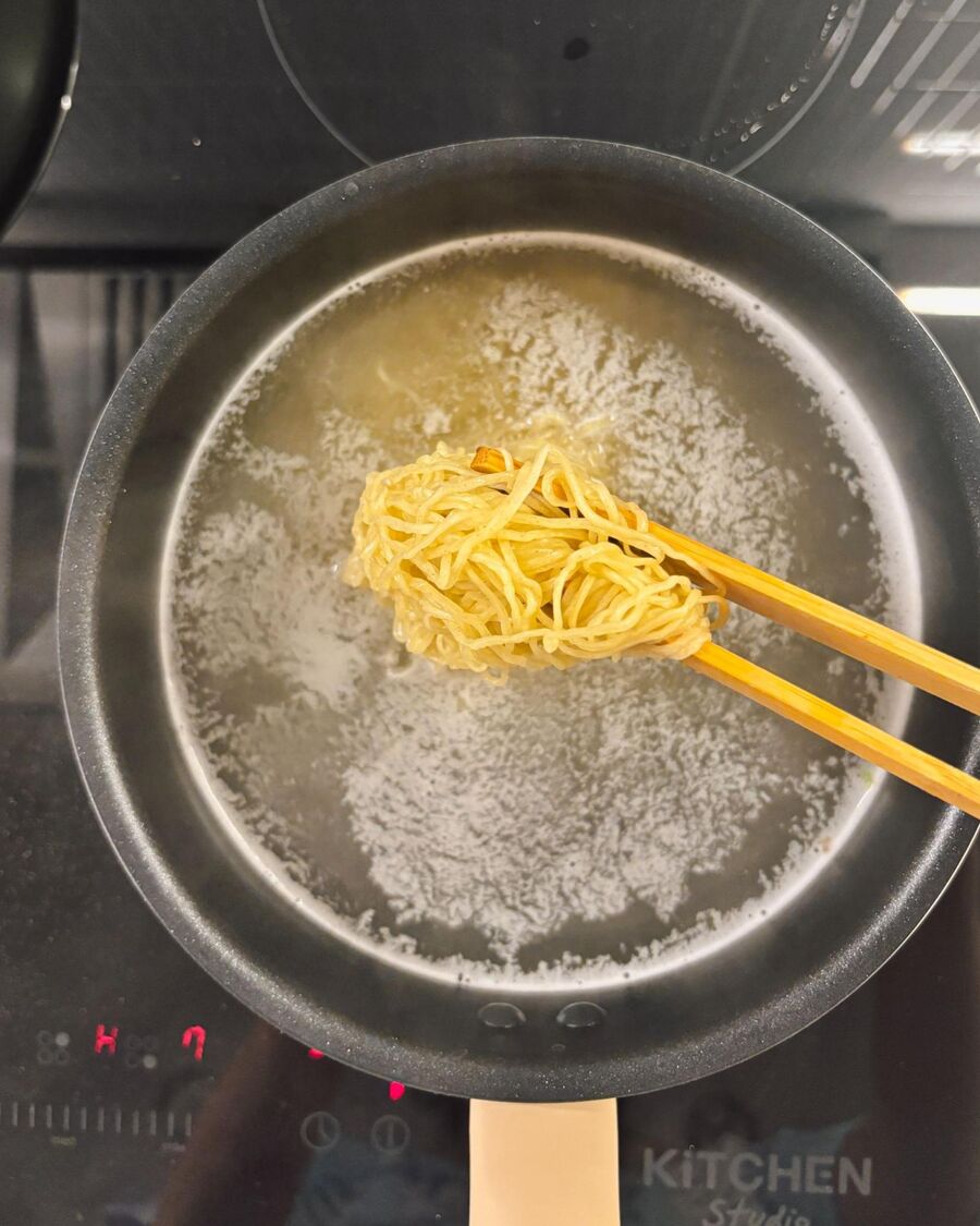 After removing the bok choy, use the same water and pot to boil the ba mee (egg noodles) for about 3 minutes, until they’re soft.