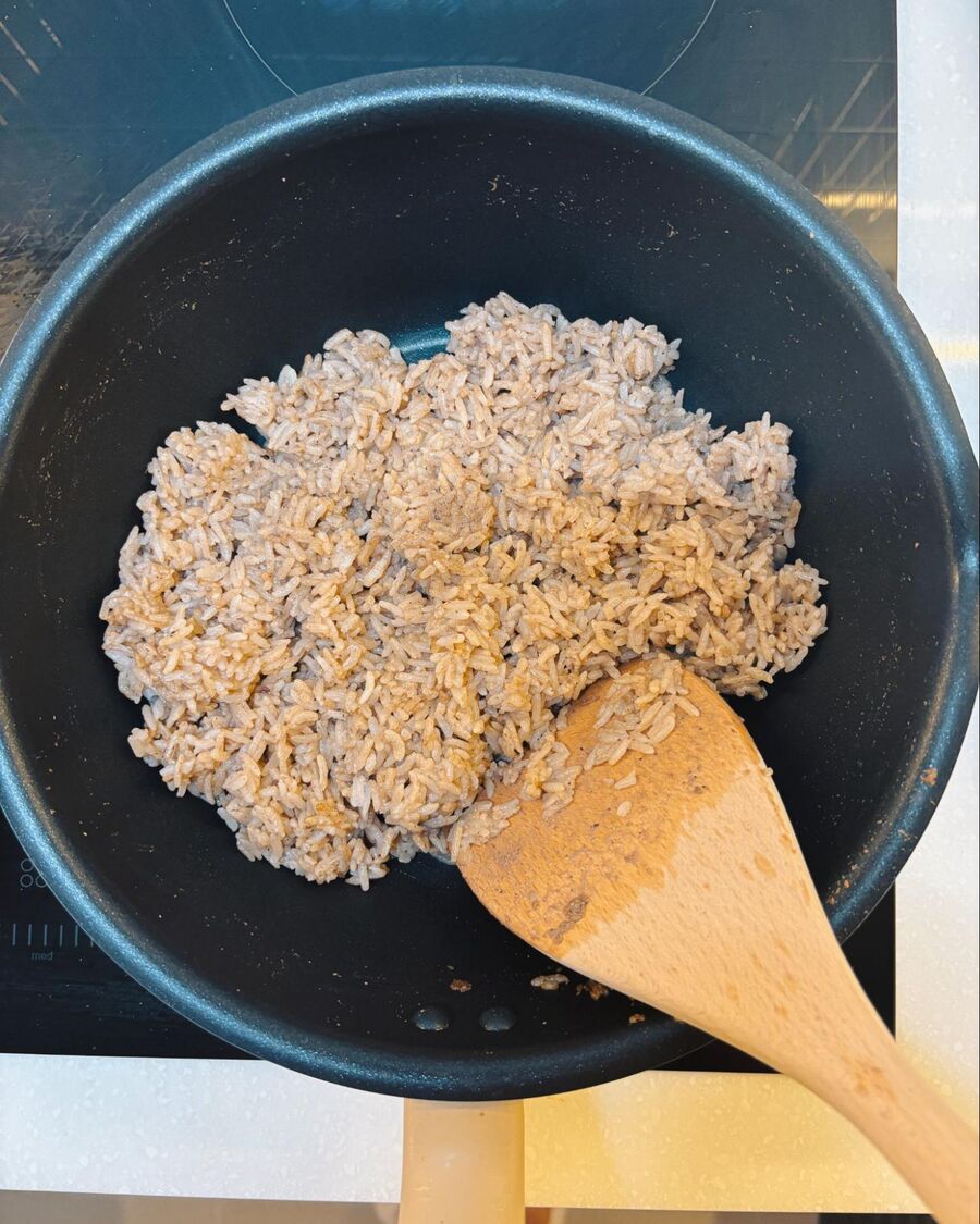 Add 2 cups of steamed jasmine rice, then stir to combine until everything is evenly mixed and the rice is well coated.