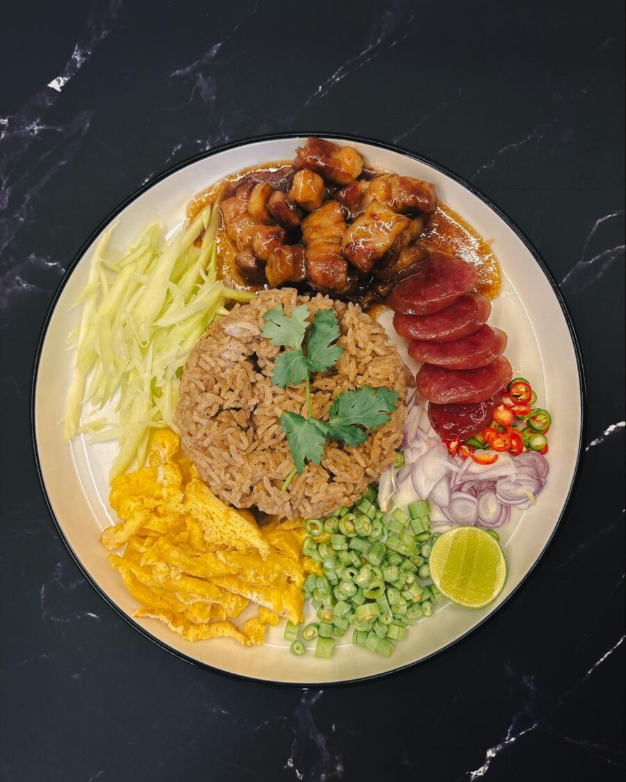 To serve, place the rice in the center of the plate and arrange the condiments neatly around it. Before eating, mix everything together thoroughly. Enjoy!