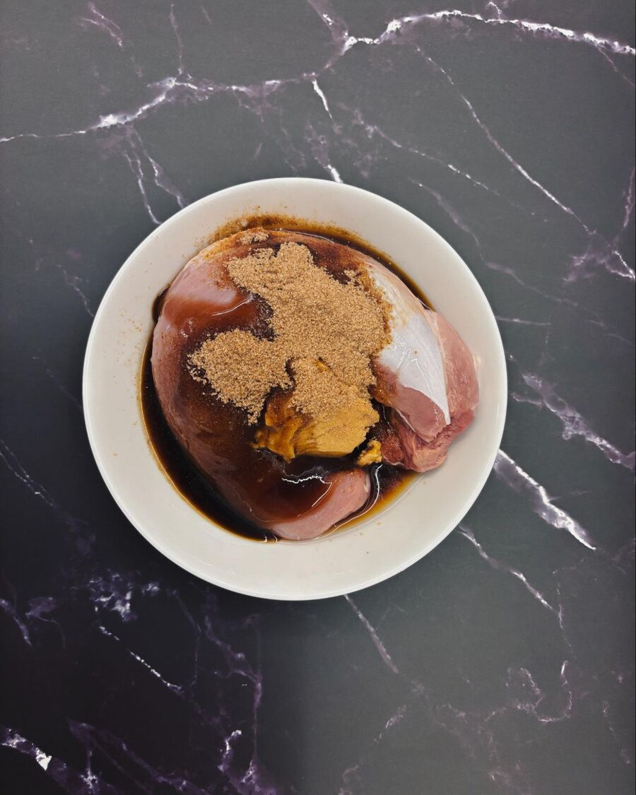 In a large bowl, marinate the pork with oyster sauce, soy sauce, palm sugar, and a pinch of five-spice powder.