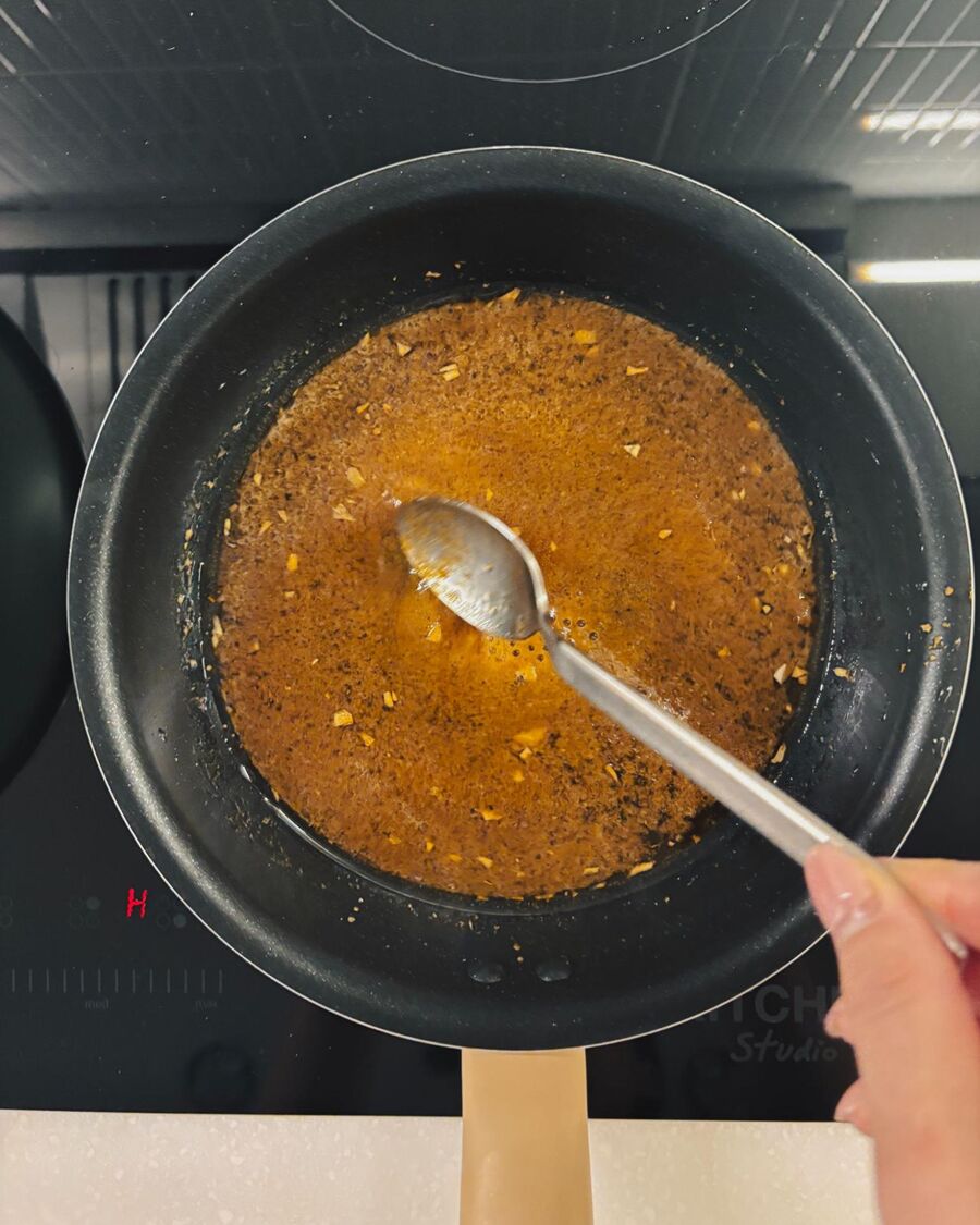 Add the leftover marinade along with 200 ml of water to the saucepan. Stir to combine and heat until the sauce starts to bubble. Then remove it from the heat.