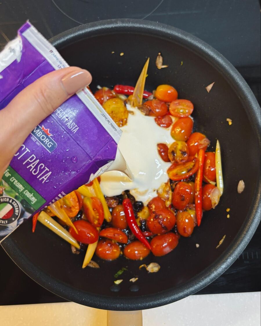 Pour in the pasta sauce, stir to combine, and bring it to a boil.