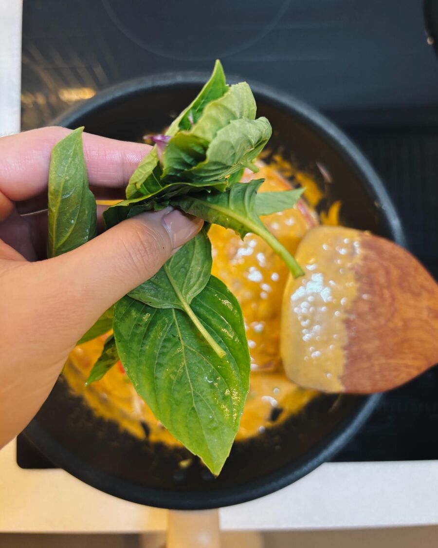 Add the basil for fragrance, then remove the pan from the heat.